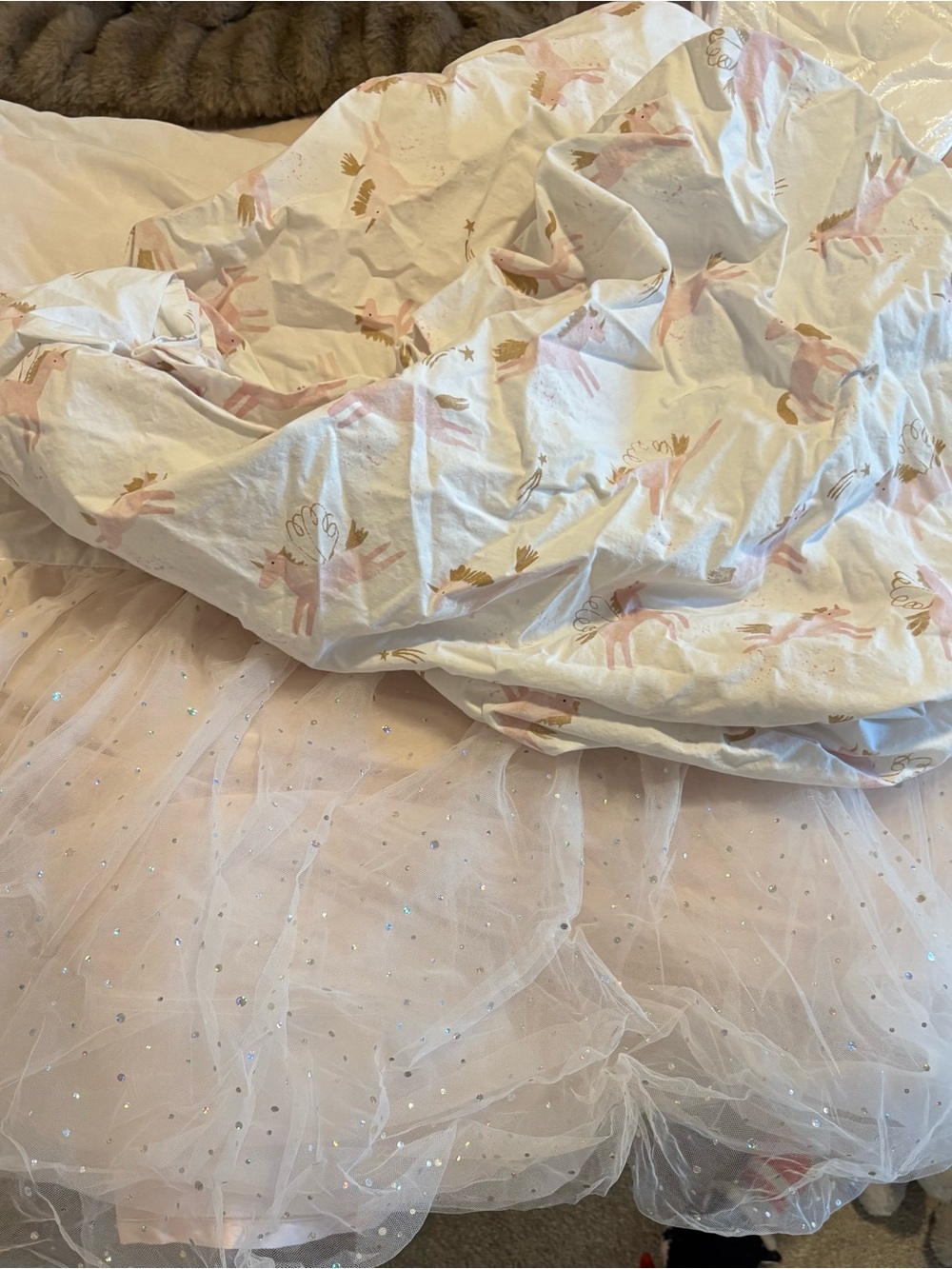 Soft Pink Unicorn crib sheet and tulle crib skirt  from Pottery Barn